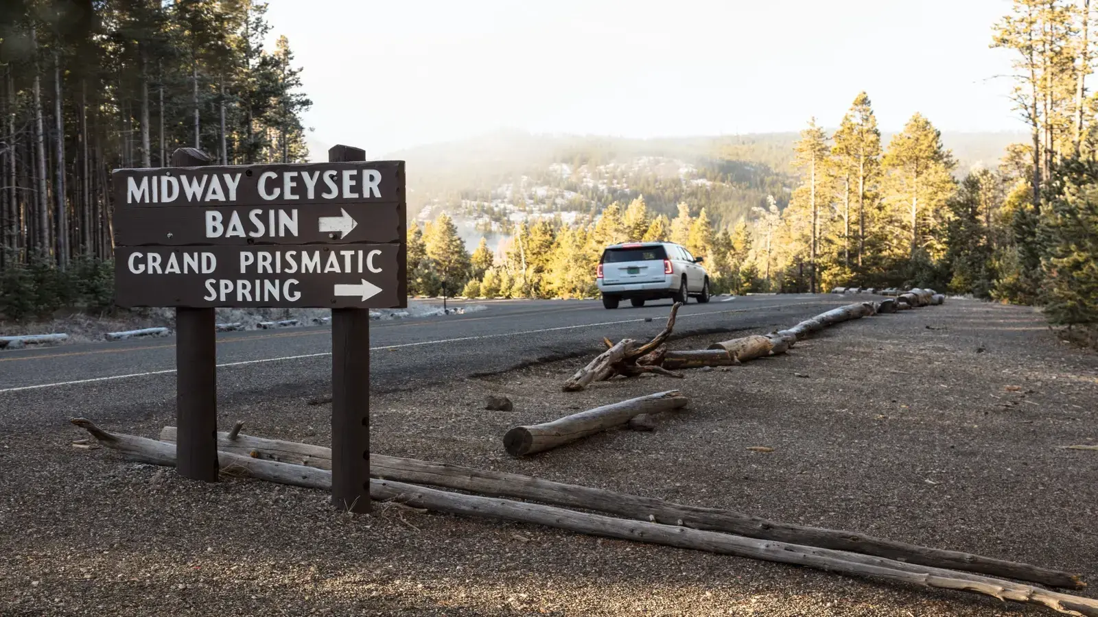 The Midway Geyser Basin and Grand Prismatic Spring sign beside the park road. U.S. National Park Service photograph.